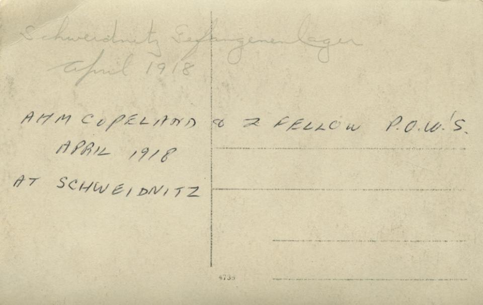 Back view. Copeland & 2 fellow P.O.W.s April 1918 at Schweidnitz Gefangenenlager